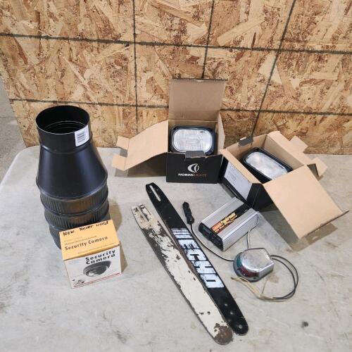 2 Unused flood lights, power Inverter, chainsaw bars