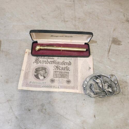 1923 German bank note, Snap-On tire guage, belt buckle