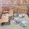 Partialy unpacked box of various bird collector plates