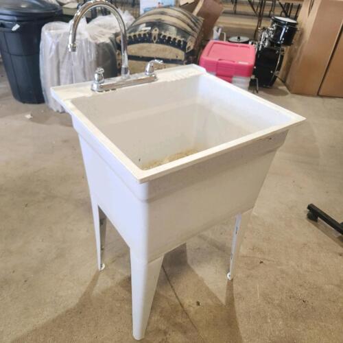 Plastic laundry tub w taps