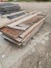 Pile of various sized used plywood