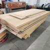 Lift of various melamine sheets out of retirement furniture shop
