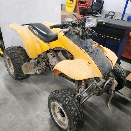 Honda 300EX sportrax four wheeler, dead battery as is, but will run & drive needing some repairs