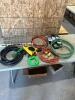 Various extension cords, drain snake, level, etc