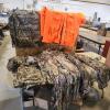 Various sized hunting clothes