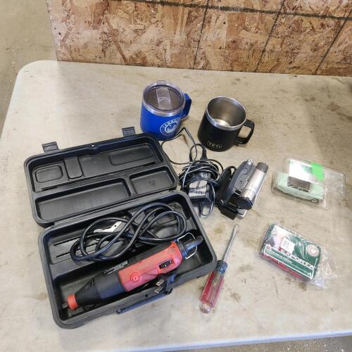 Die grinder, travel mugs, video camera, 1951 mercury