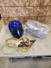 Booster cables, motorcycle helmet, roasting pan