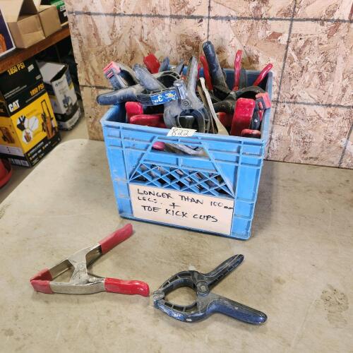 Milk crate full of clamps