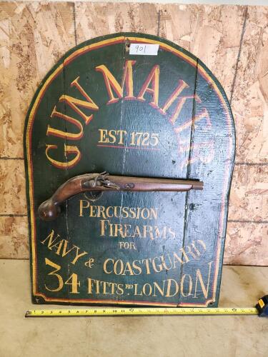 Vintage gun wall hanger on wooden sign