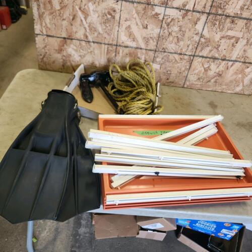 Boat anchor, swimming fins, plastic drawer trays