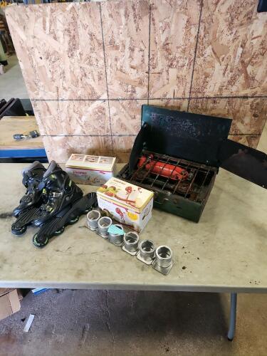 Spice rack, potatie chipper, apple peeler, sz 6 roller skates, naptha camp stove