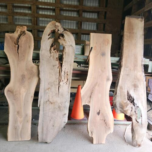 4 Various sized live edge wood slabs