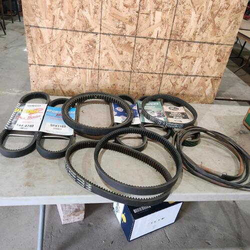 Various new & used snowmobile belts