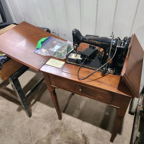 Singer sewing machine in cabinet