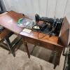 Singer sewing machine in cabinet