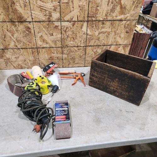 Trouble light, sanding belts, vintage ammo box
