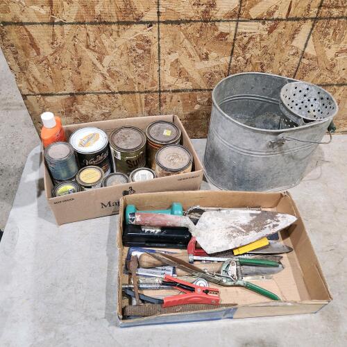 Various cans of stains, paints, wash bucket, etc.