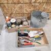 Various cans of stains, paints, wash bucket, etc.