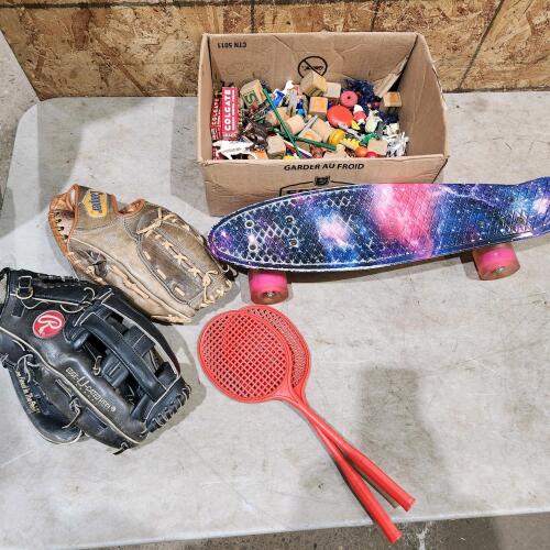 Baseball gloves, kids toys, skateboard