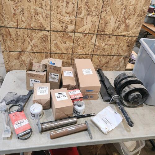 Tub of assorted Bobcat parts