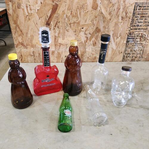 Empty whiskey bottles, etc.