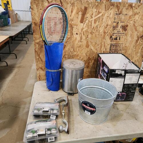 Passage door knobs, tennis rackets, garbage can, bucket