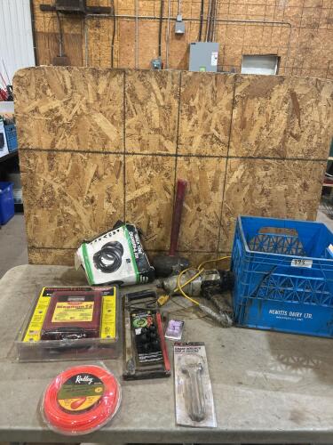 Unused 12v 30 mile fencer, string trimmer line, other tools