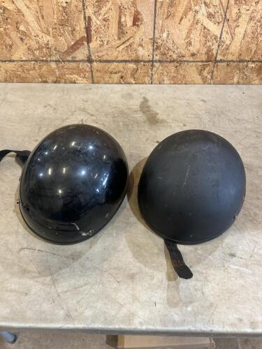 2 small motorcycle helmets