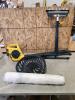 Rolling stand, tractor seat, electric leaf blower, roll of plastic
