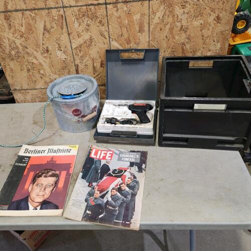 Soldering iron, magazines, minnow trap, milk crate