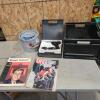 Soldering iron, magazines, minnow trap, milk crate