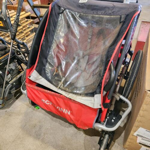 Tow behind child carrier
