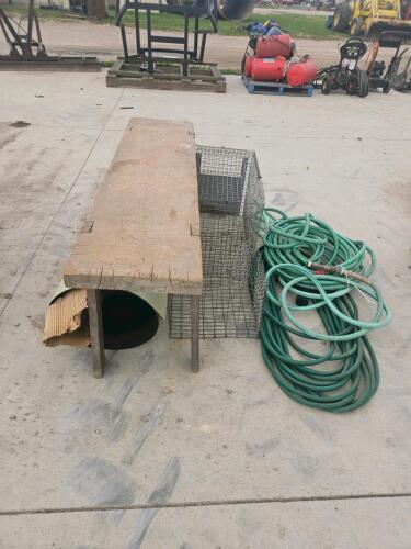 Garden hoses, animal cages, bench, roll of alum