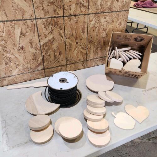 Roll of bungee string, wooden crafts