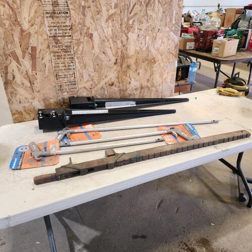 Unused air guns, vintage bar clamp, 4x4 post holders