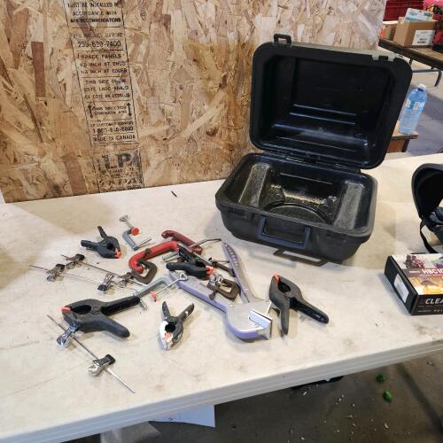 Assorted clamps, empty case