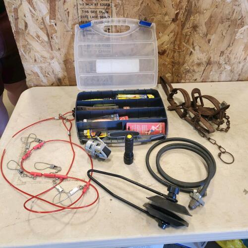 Fishing tackle, propane hose, flashlight, traps, boat muffs