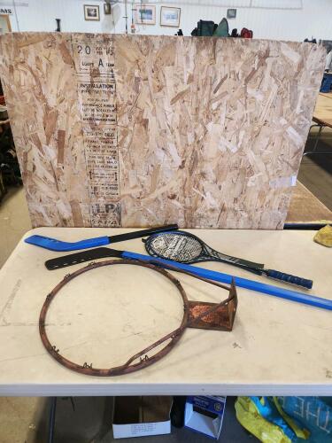 Basketball hoop, badminton racket, ball hockey sticks