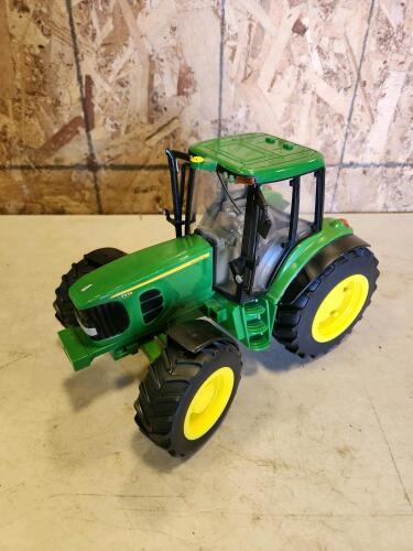 Plastic John Deere tractor toy