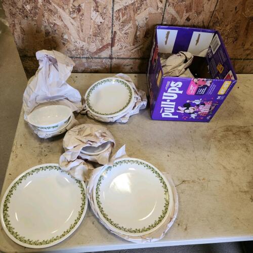 4 place setting of Corel dishes partially unpacked