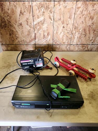 DVD player, battery charger, roller blade figure skate guard