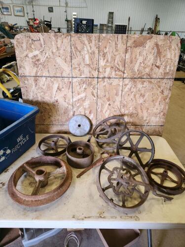 Assorted vintage cast iron wheels & tools
