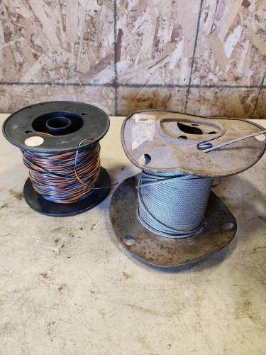 Roll of string trimmer string, roll of 1/8" cable