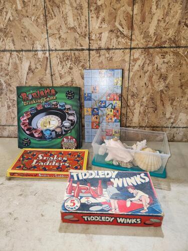 Assorted vintage board games, seashells
