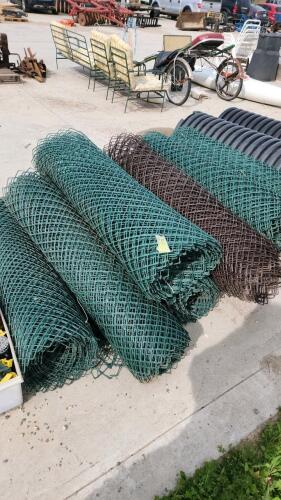 Rolls of plastic barricade fence
