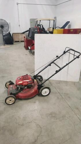 Running Toro self propelled mower