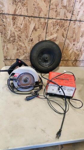 Battery charger, skilsaw, wheelbarrow wheel