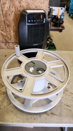 Electric heater, hose reel