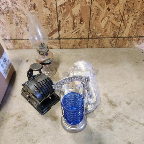 Meat grinder, oil lamp, cheque writer