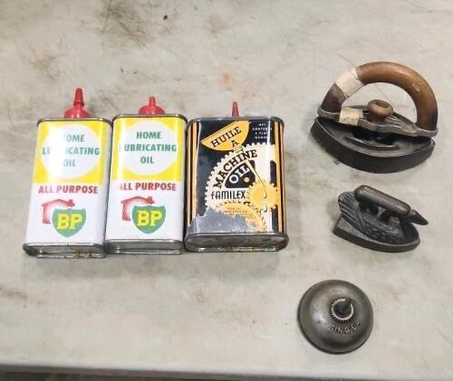 Singer oil can, sad irons, oil tins